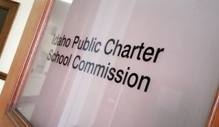 A glass door with the Idaho Public Charter School Commission name