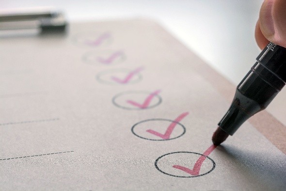 A checklist marked complete with purple marker